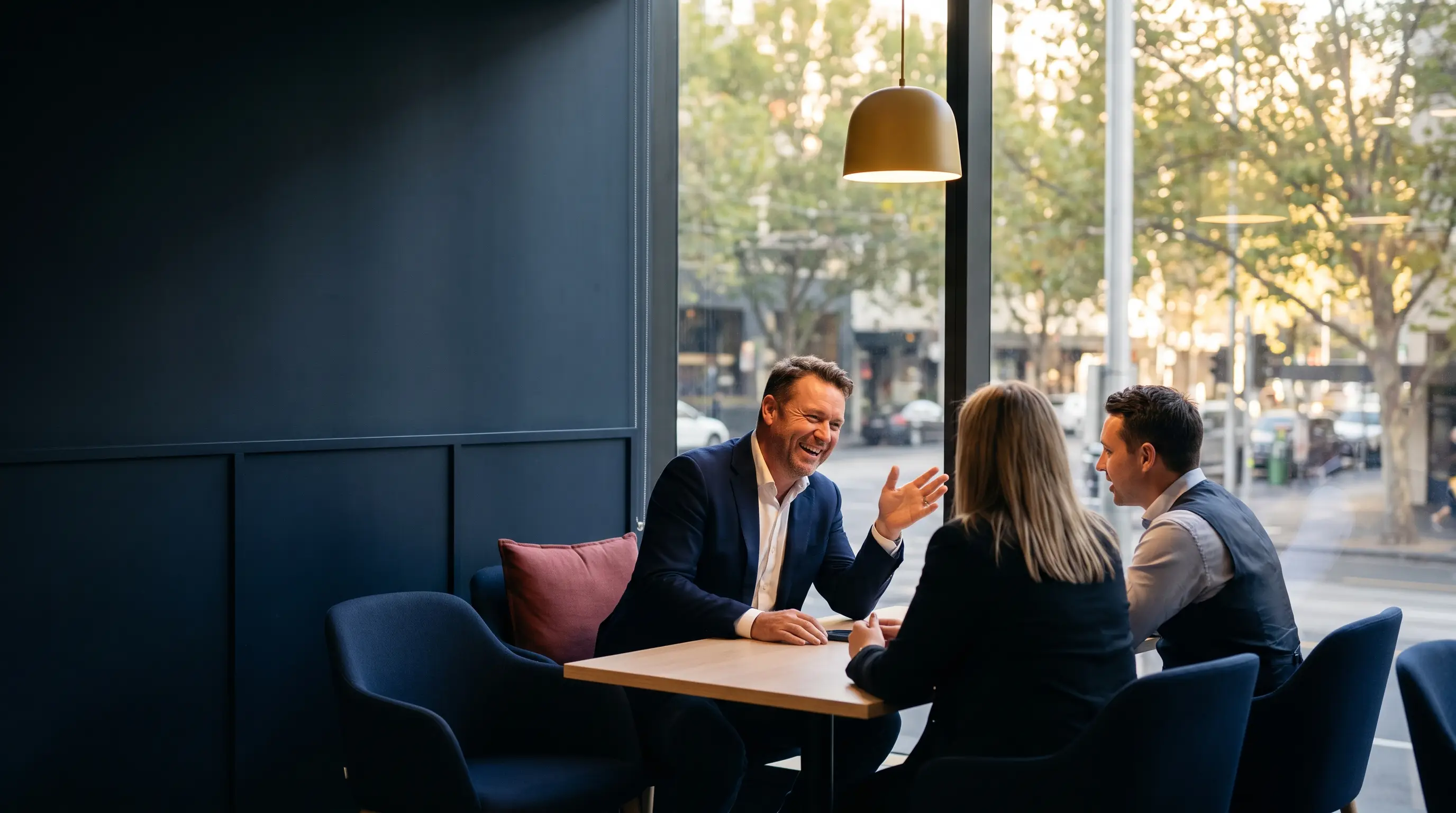 Financial advisers meeting a client in a Melbourne office